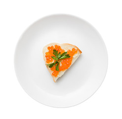 sandwich with red caviar and butter on a plate isolated on white background with clipping path