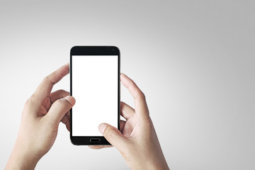 Black mobile phone isolated on white clipping path inside a gray background.