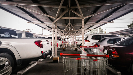Cart in parking lot Adjust the image darker tone.
