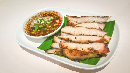 Grilled sliced Pork BBQ Savory and spicy sauce . Adjust the image darker tone