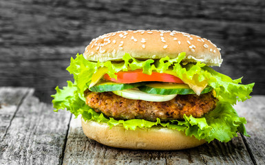 Beef burger, homemade sandwich with roasted meat and vegetables