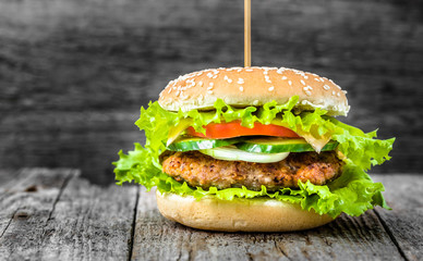 Beef burger, hamburger bun with meat and vegetables, cheeseburger