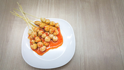Roasted pork balls or meatballs with sweet spicy sauce