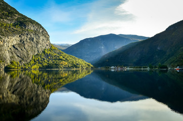 Fototapeta premium perfect reflection of mountains in clear fjord
