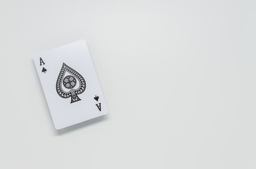 Black spade Ace card on white background and selective focus