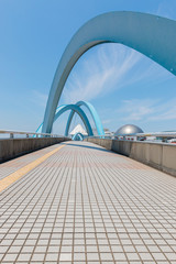 Modern bridge with bright sky background.