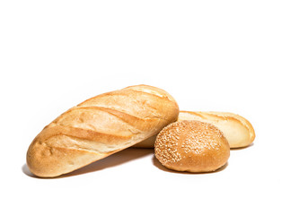 Different kinds of wheat ar corn bread on white