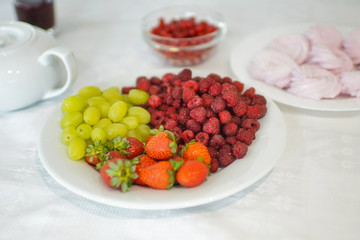 Bowl with berries on the table