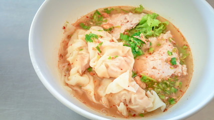Tom Yum pork wonton hot and sour soup. pork dumpling And seafood.