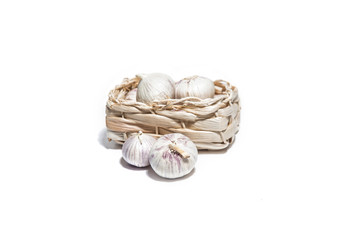 Garlic isolated on white in a basket