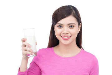 Portrait of pretty smiley asian young woman with glass of milk