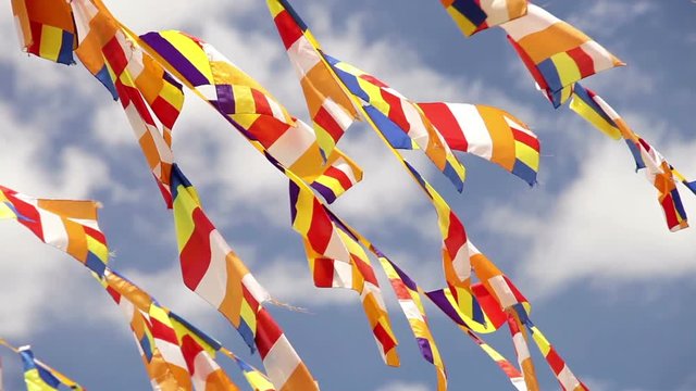 A lot of Buddhist flags waving on the wind with blue sea background in Thikse Monastery, India