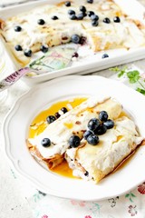 Baked crepes with cheese maple syrup and blueberries
