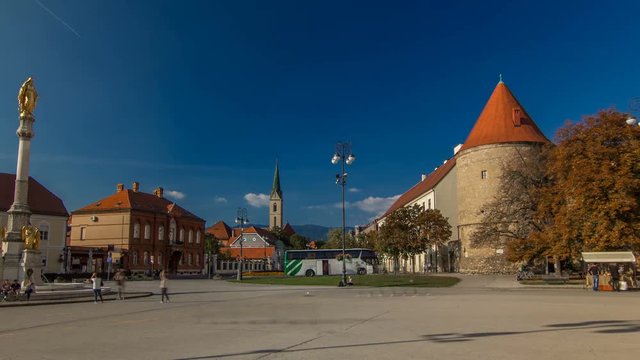 Holy Mary monument on square in front of the Cathedral timelapse hyperlapse and Historic buildings in citycentre in Zagreb, Croatia