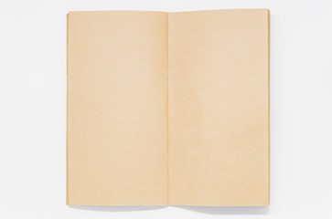 Opened Brown plain notebook on white background and selective focus