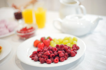 Bowl with berries on the table