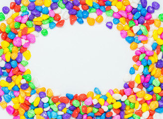 Space area in center of colorful stone on white background with selective focus