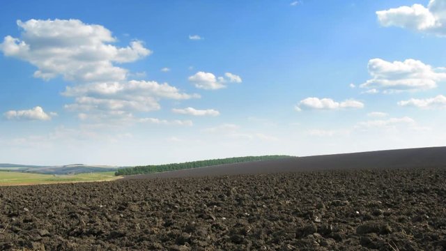 Loop with chernozem field after plowing in the spring. Time lapse FHD