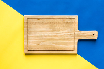 Top View of Cutting Board over Colorful Background