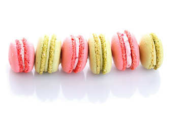 Sweet and colourful french macaroons or macaron on white background