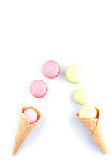 Colorful macaron pink color in ice cream cone of waffle
