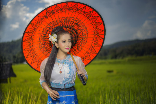 Beautiful Asian Girl In Myanmar Traditional Costume, With Red Ba