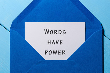 Words have power - inscription written on letter at blue envelope