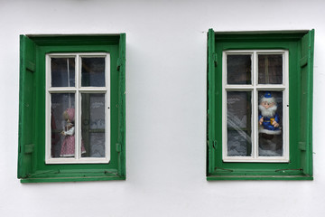Dolls in the window in a village house