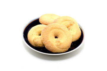 Sugar Cookies in a saucer on a white background.