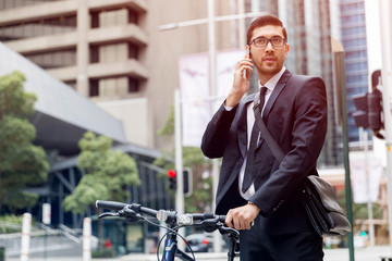 Young businessmen with a bike