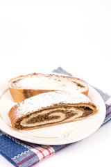 Homemade domestic strudel with walnuts on the plate