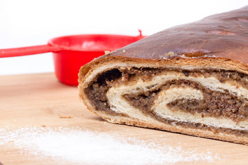 Strudel with walnuts on the wooden board