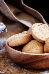 Homemade cookies with nuts, dark wood background, selective focu