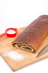 Strudel with walnuts on the wooden board