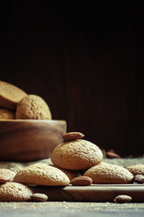 Homemade cookies with nuts, dark wood background, selective focu