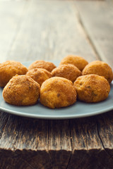 Arancini sicilian street food - rice balls stuffed with meat cooked