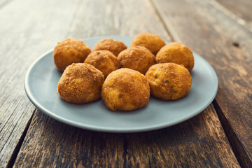 Arancini sicilian street food - rice balls stuffed with meat cooked