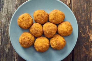 Arancini sicilian street food - rice balls stuffed with meat cooked