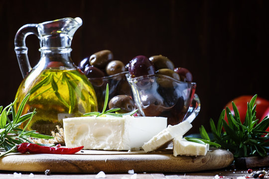 Greek feta cheese, dark wood background, selective focus