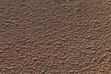 brown texture of a concrete wall closeup