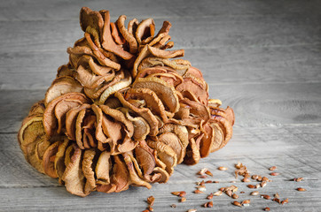 Dried apples on a gray wooden background