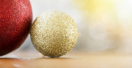 Web banner of glittering golden and red Christmas baubles