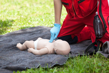 Infant CPR dummy first aid training. Cardiopulmonary resuscitation. Cardiac massage.