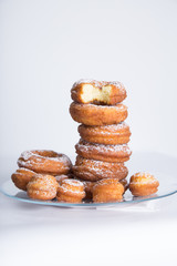homemade donuts with powdered sugar