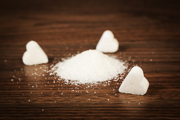 Fototapeta na wymiar Sugar and sugar lumps form of heart