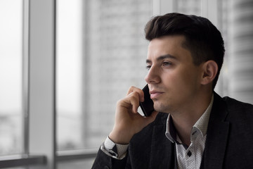 Young businessman make a phone call