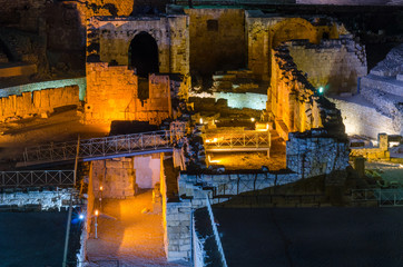 Illuminated roman theather at night in Tarragona, Spain