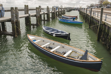 Fototapeta na wymiar Rowing boats in the harbour of West Terschelling.