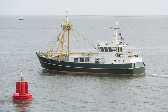 Fishing boat on the Wadden Sea .