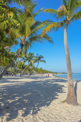 The popular beach with fine white sand of Smathers Beach, Key West, Florida. Smathers Beach is Key West's longest beach and is located on the Atlantic Ocean side. Popular tourist destination.
